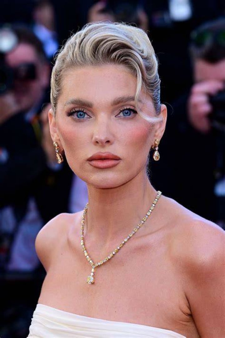 Elsa Hosk displays her very toned tummy as she models a green bikini