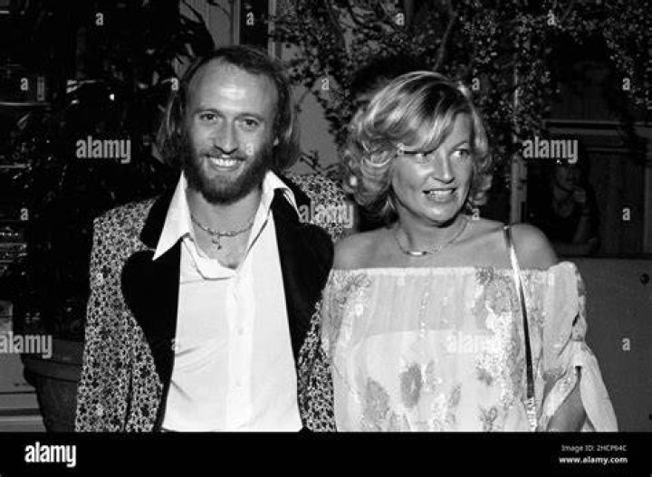 MAURICE GIBB with wife Yvonne Spenceley and children Adam Gibb and